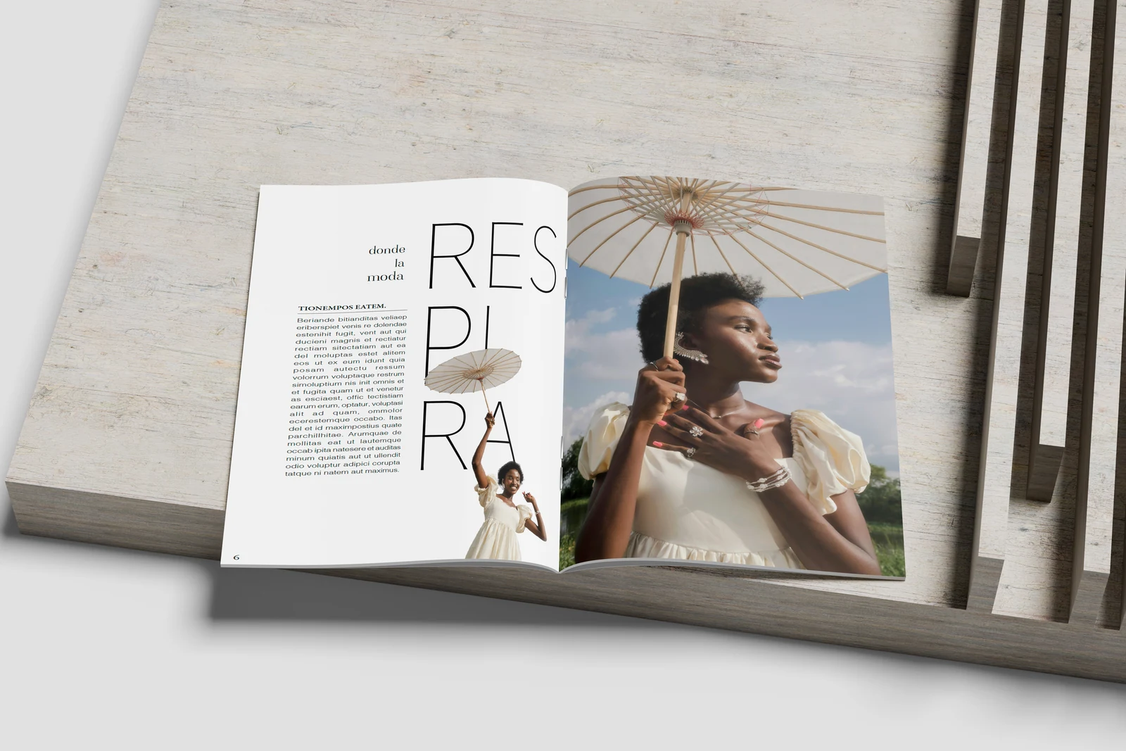 Revista conceptual RESPIRA abierta por una doble página con tipografía vertical y fotografía en blanco, diseño editorial de Paula Miralles